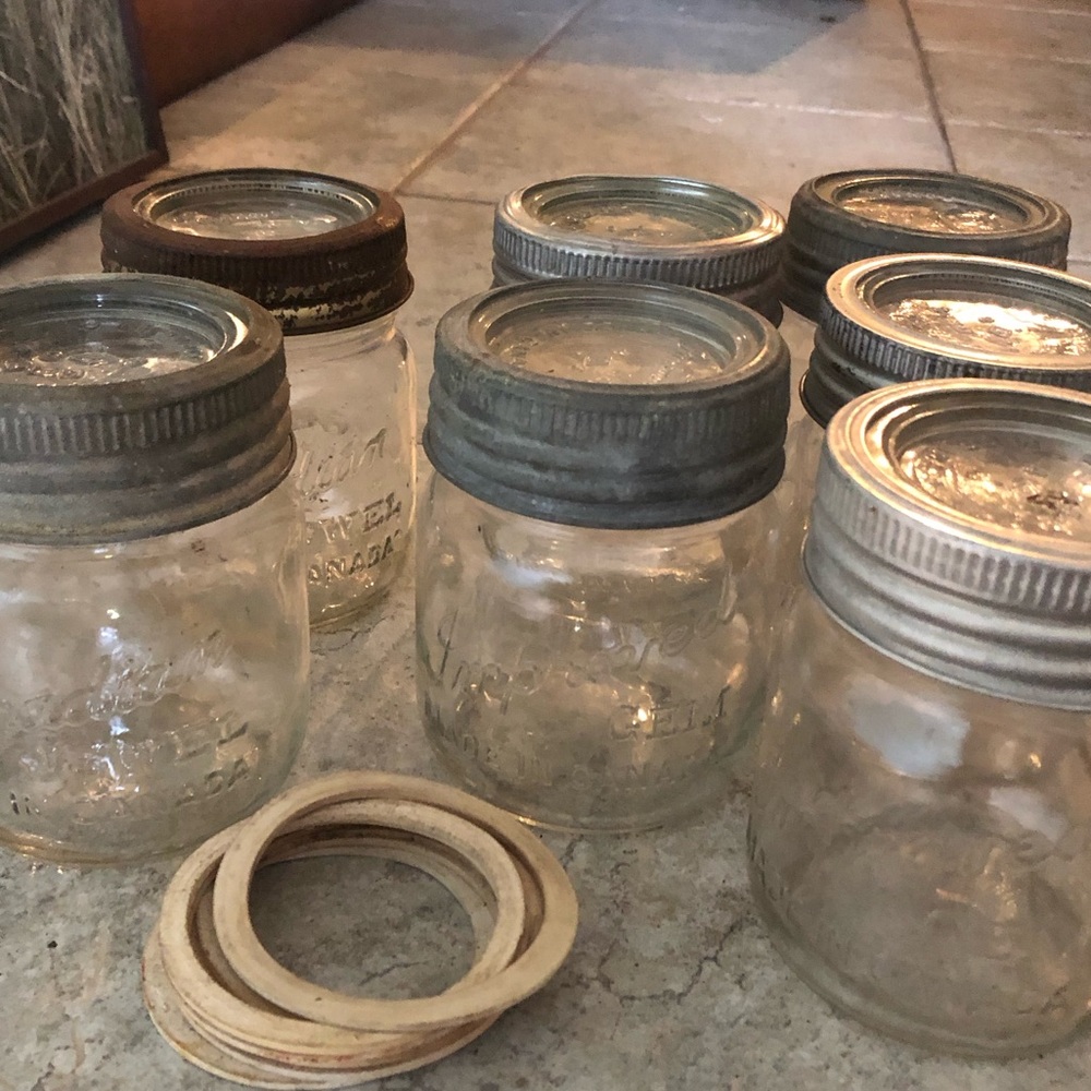 A Dozen Clear Glass Vintage Jars with Lids
